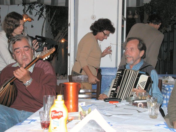 Nikos Politis and Leif playing in Lulu's taverna, with a Greek TV camera-person in the background.